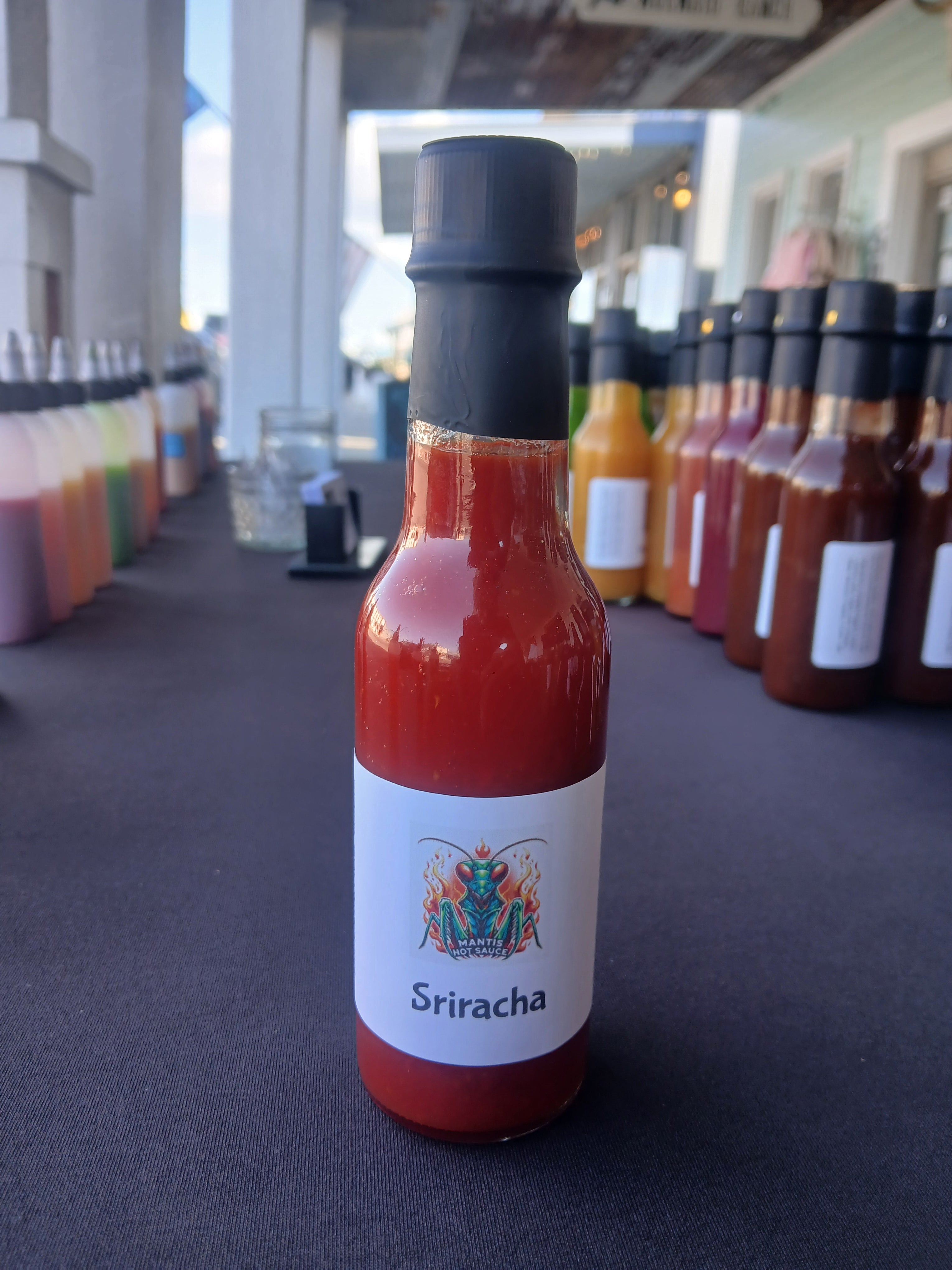 Sriracha hot sauce in 5 oz bottle with the old label.